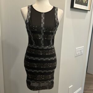 Nasty Gal sleeveless mini stretch dress, back zipper closure and front mesh.